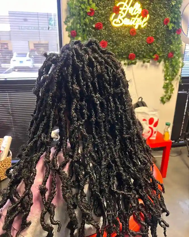 Shoulder-length passion twists with curled ends and a full layered finish, hairstylist located in Glendale, AZ