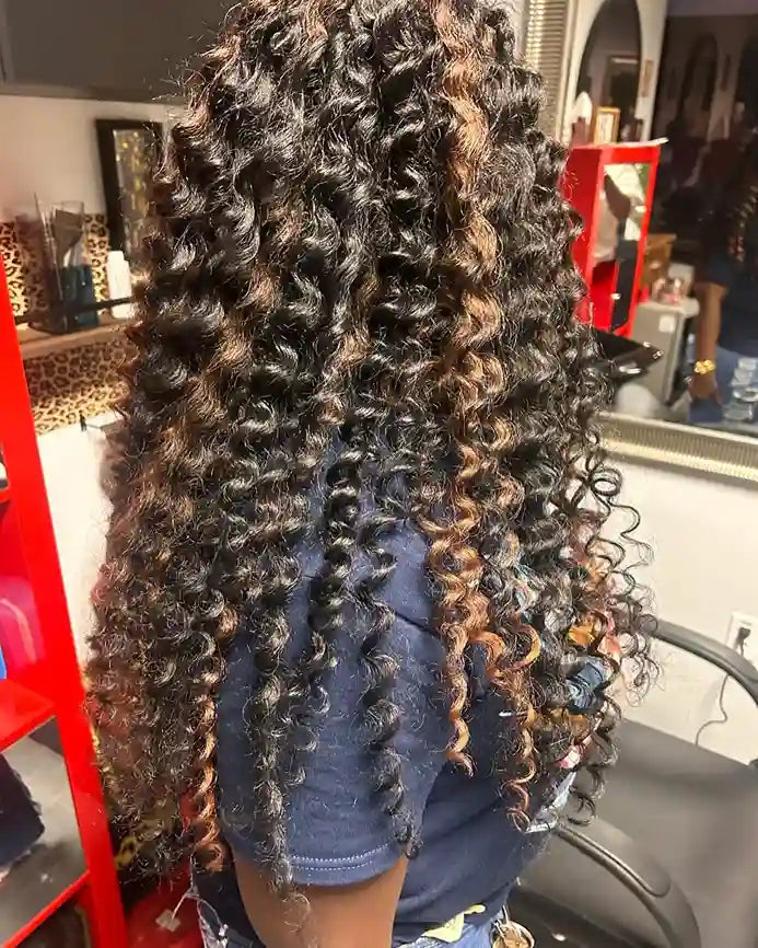 Long boho crochet curls with black and caramel brown highlights, hairstylist located in Glendale, AZ
