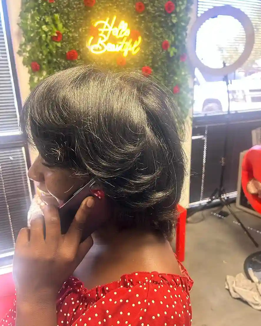 Short layered pixie cut with smooth side-swept curls and a polished finish, hairstylist located in Glendale, AZ