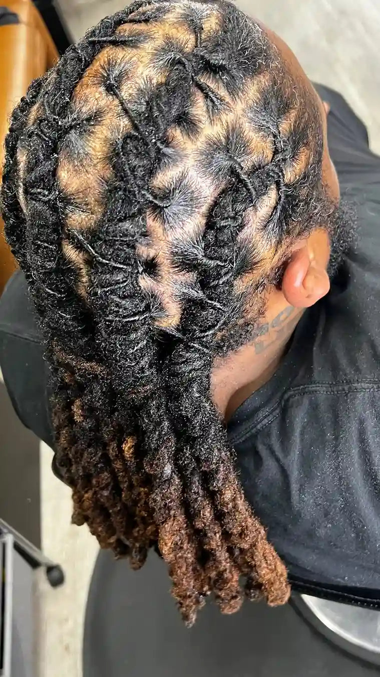 Men’s loc retwist with star parting design and long dreadlocks, hairstylist located in Philadelphia, PA
