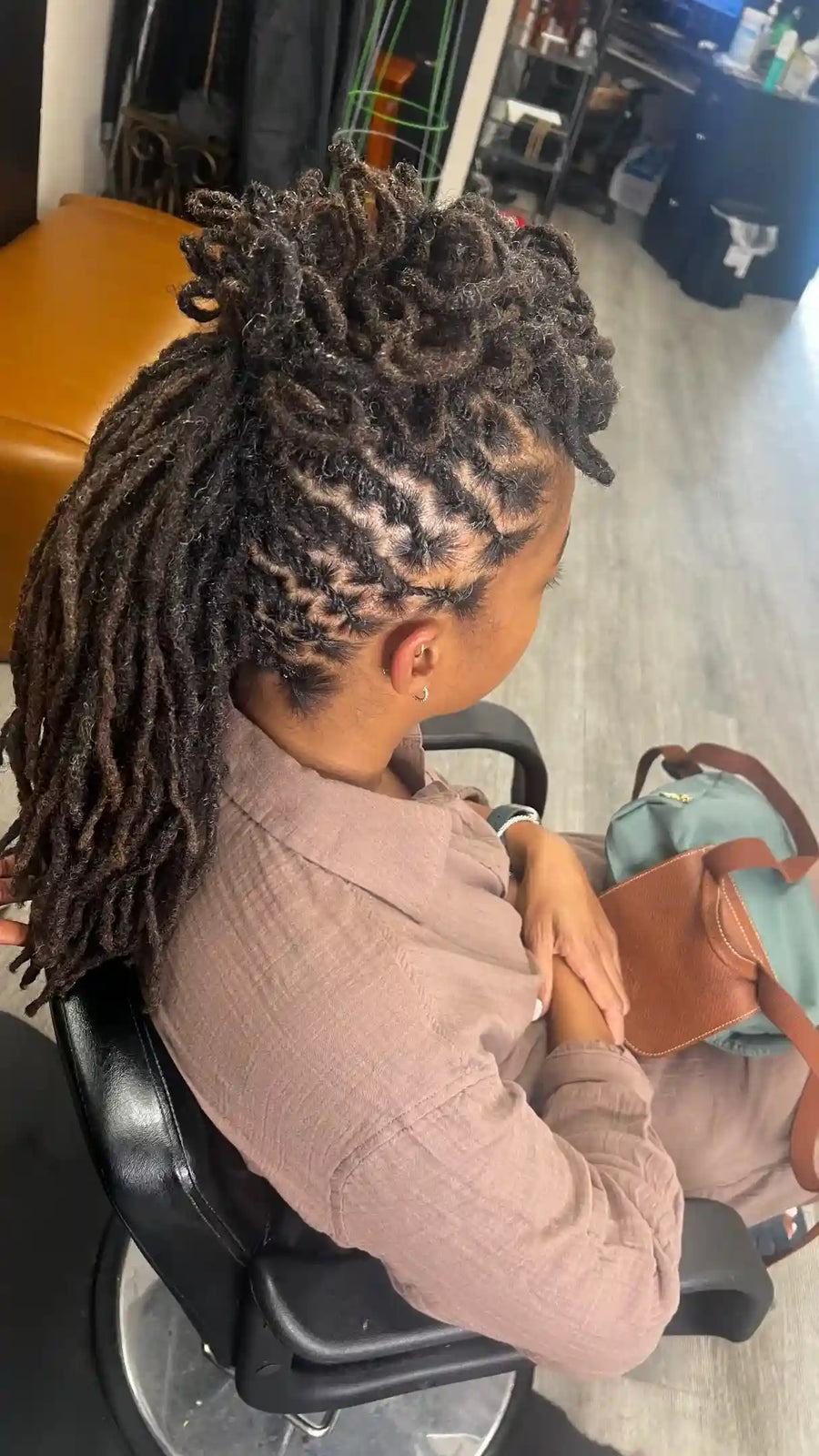 Loc updo ponytail with intricate parting design, hairstylist located in Philadelphia, PA