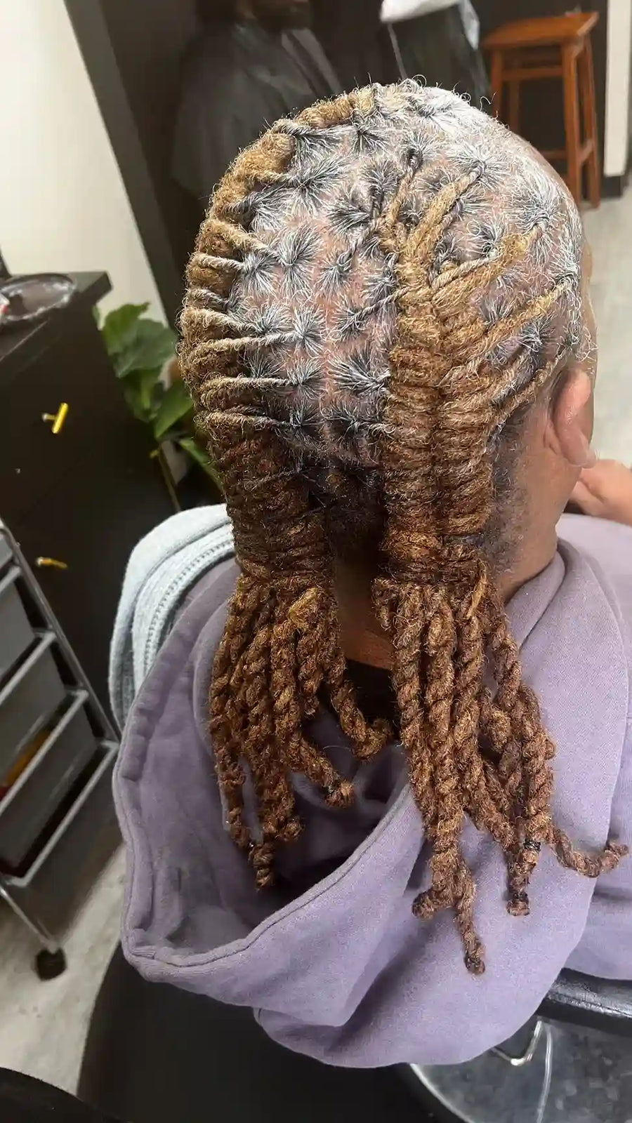 Two strand twist loc style with clean scalp parting, hairstylist located in Philadelphia, PA