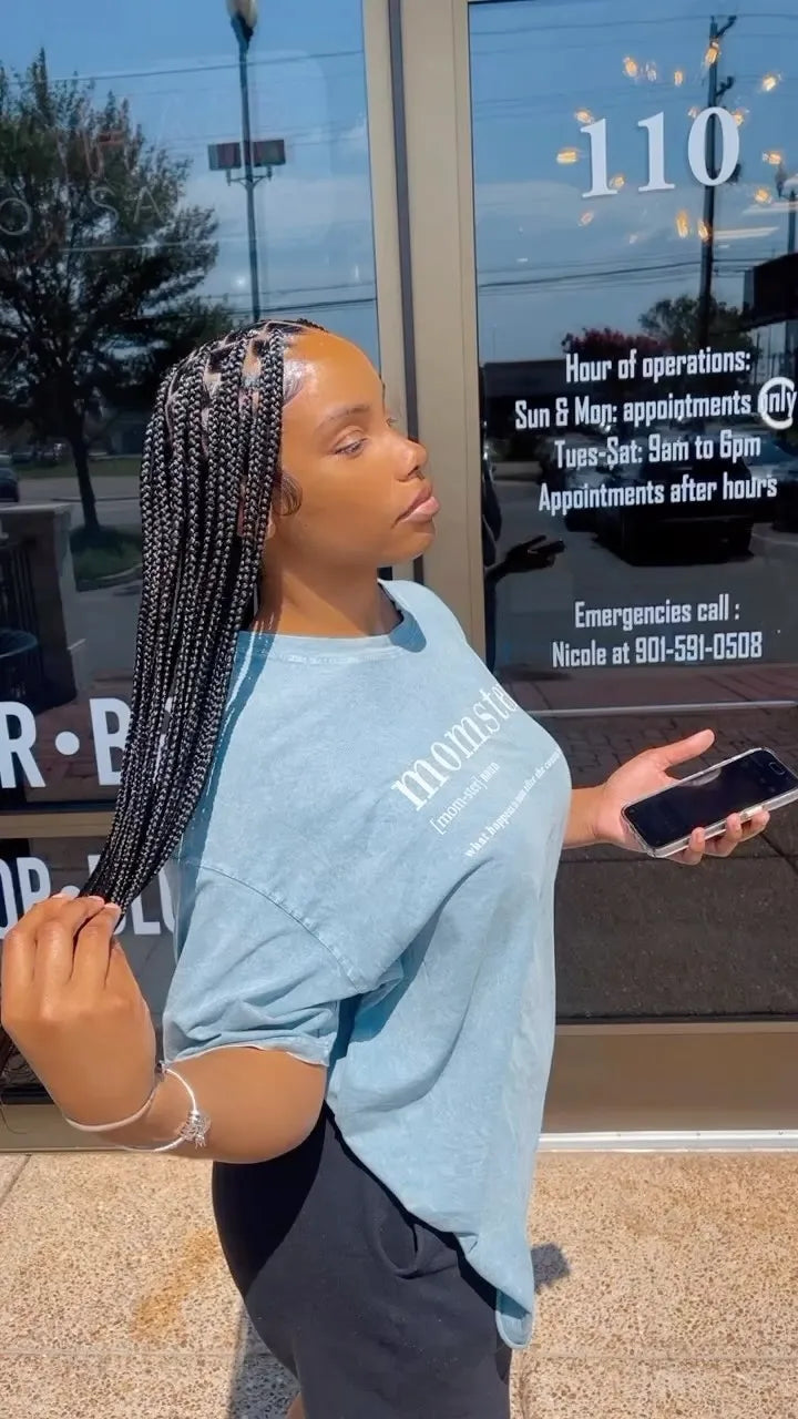 Long medium box braids with center part and clean square sections, hairstylist in Memphis, TN
