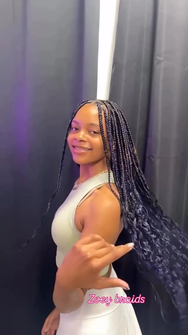 1. Long brown knotless braids with blonde highlights and lightweight braided finish, hairstylist located in Franklin Square, NY