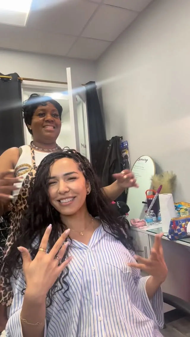 Long black boho knotless braids with wet and wavy curly texture, hairstylist located in Franklin Square, NY
