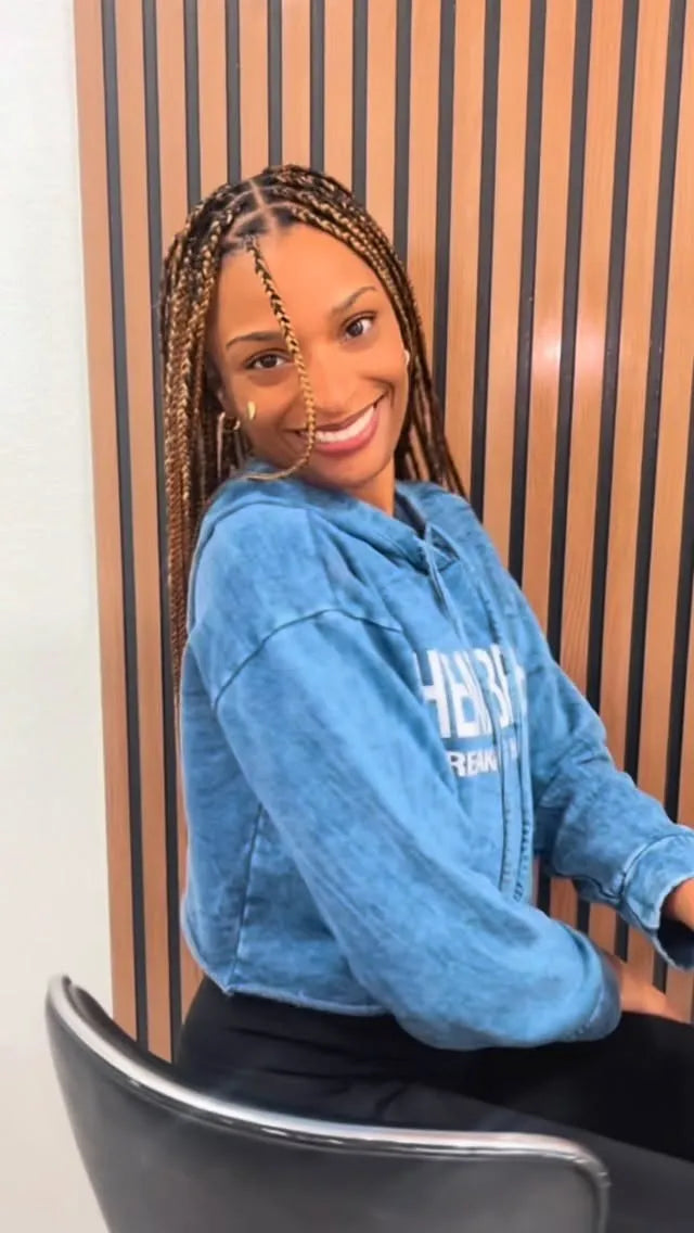 Medium-length brown knotless box braids with neat square parts, hairstylist located in Franklin Square, NY