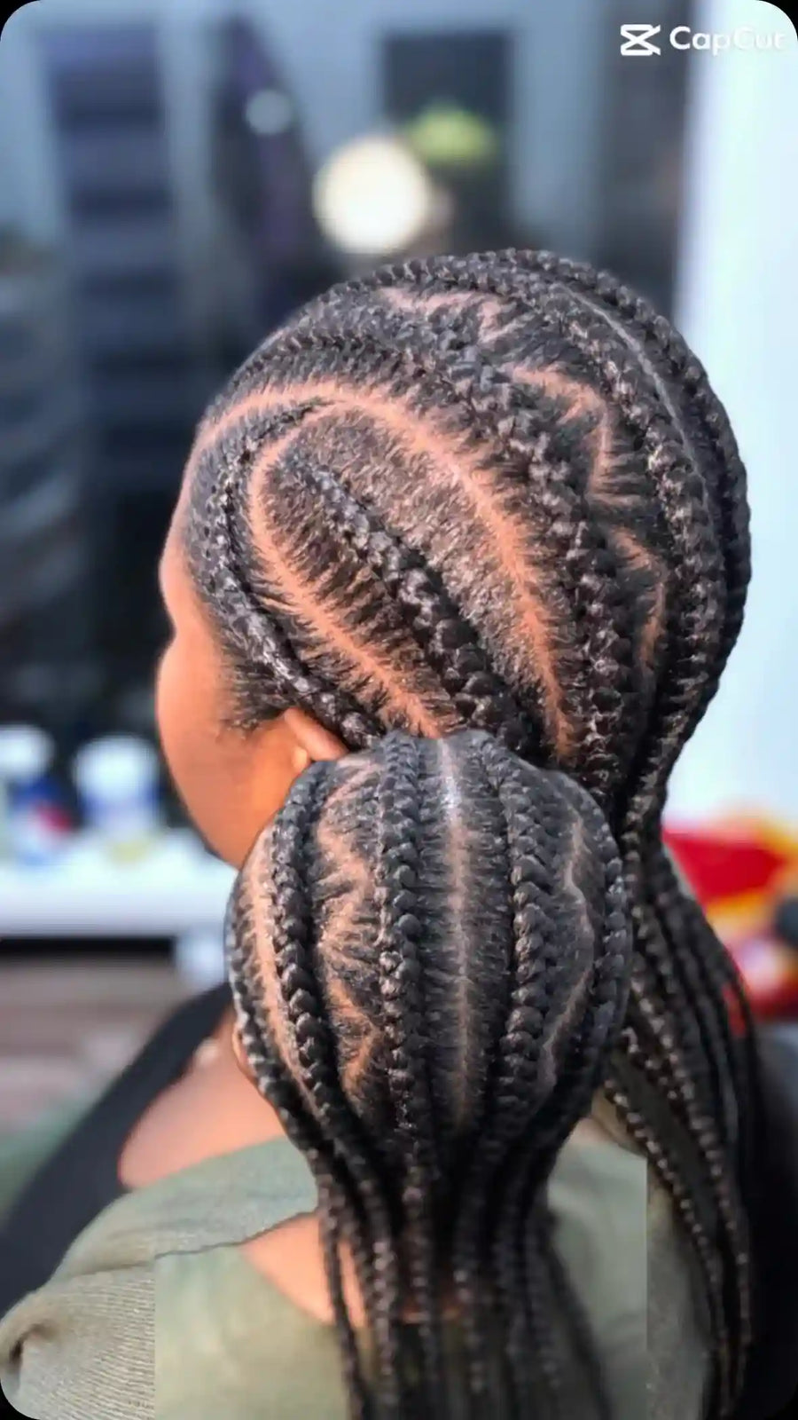 Black stitch-braid ponytail with curved cornrow patterns and a braided side ponytail, hairstylist located in Chesterfield, VA