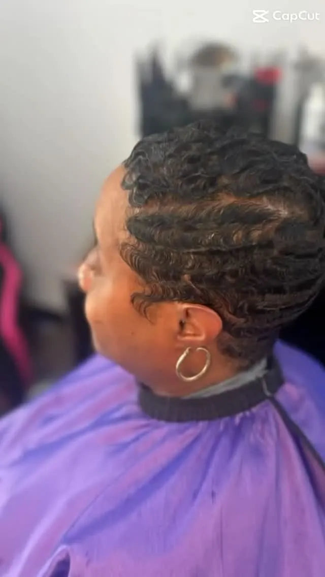Short black finger-wave pixie hairstyle with sculpted side waves and tapered nape, hairstylist located in Chesterfield, VA