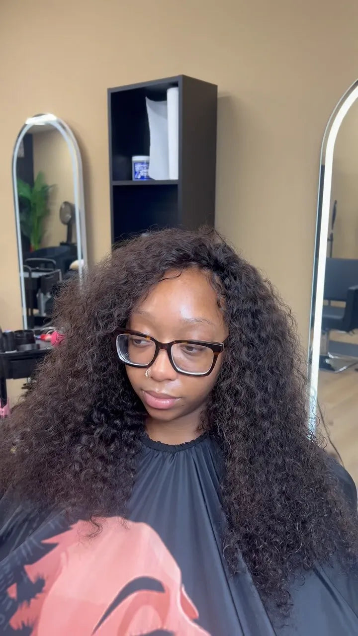 Natural black kinky curly sew-in hairstyle with full volume, hairstylist located in Reisterstown, MD