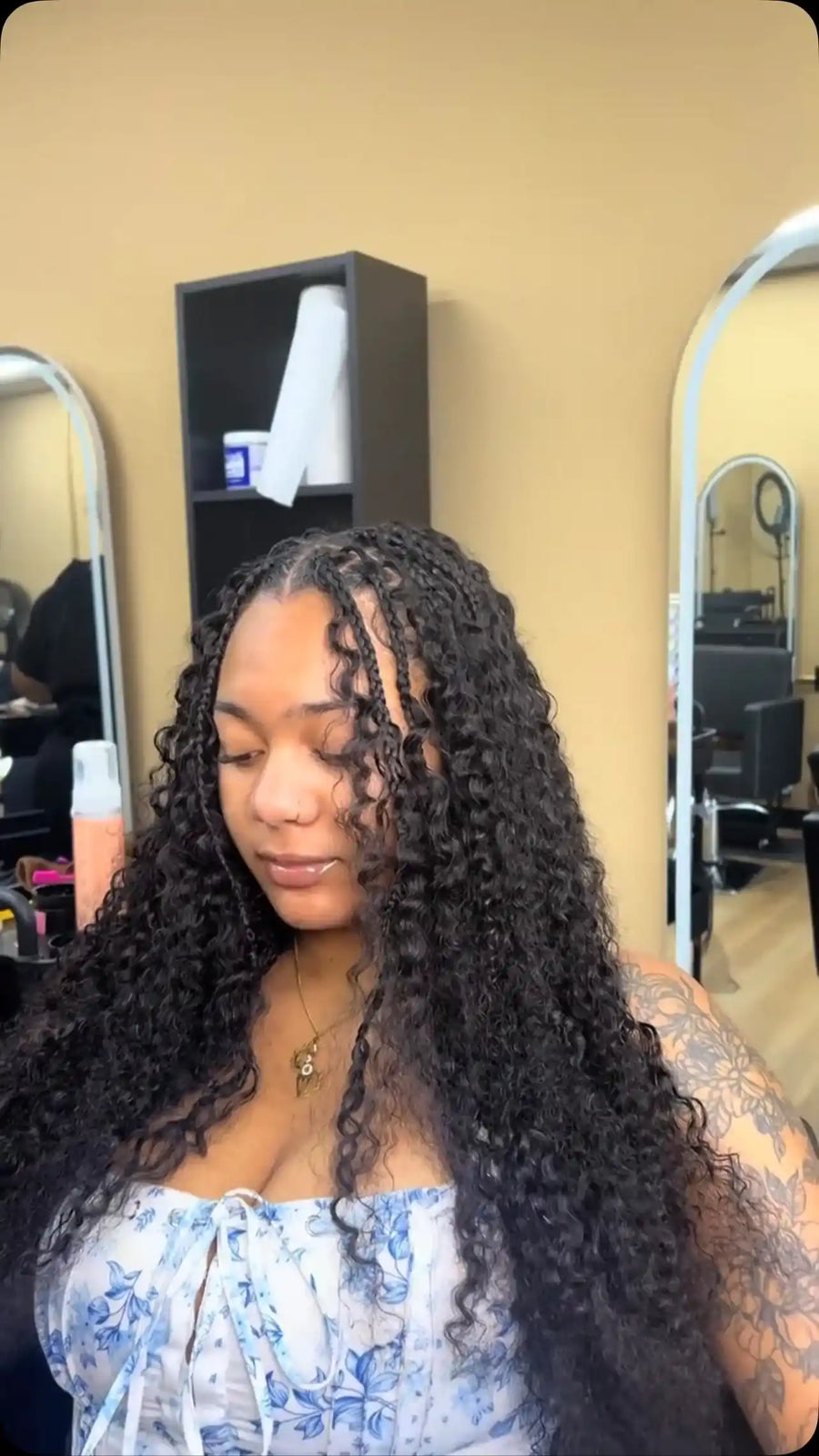 Long black boho knotless braids with curly human hair pieces, hairstylist located in Reisterstown, MD