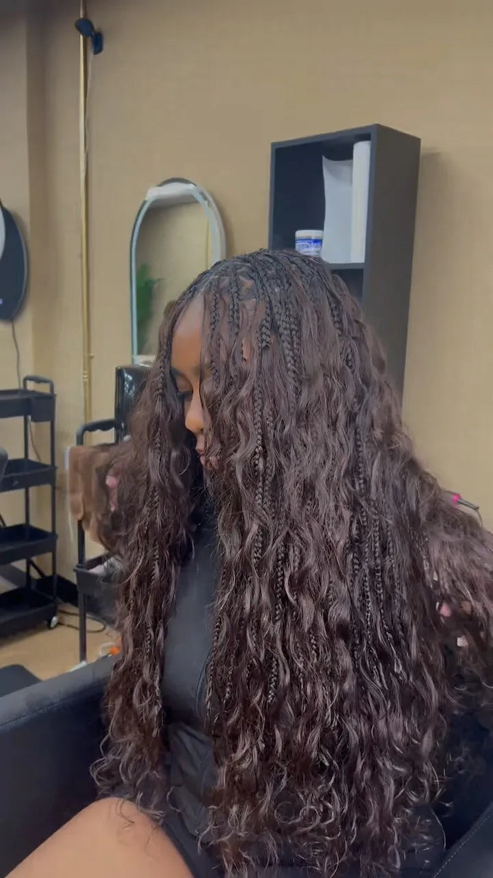 Long boho knotless braids with loose wavy curls, hairstylist located in Reisterstown, MD
