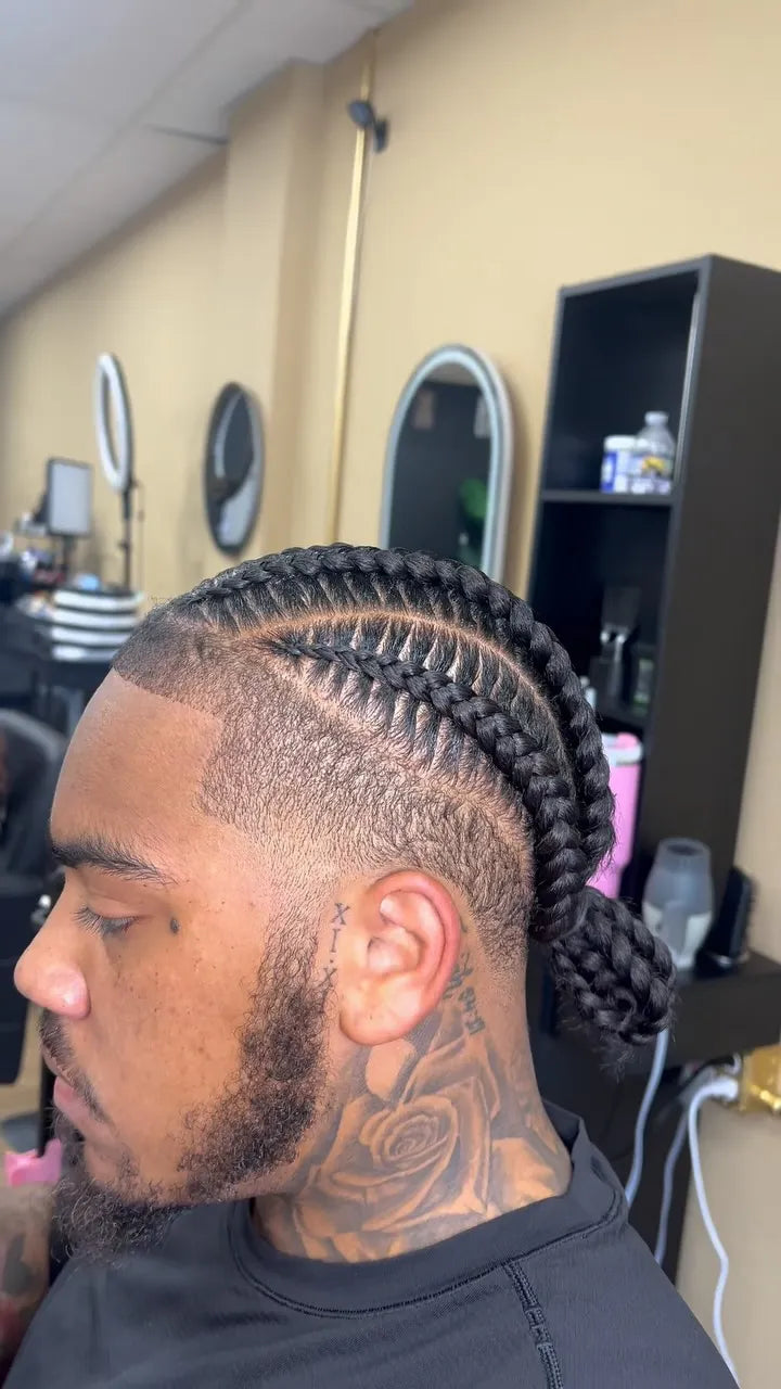Men’s stitch braids with clean fade and braided ponytail, hairstylist located in Reisterstown, MD