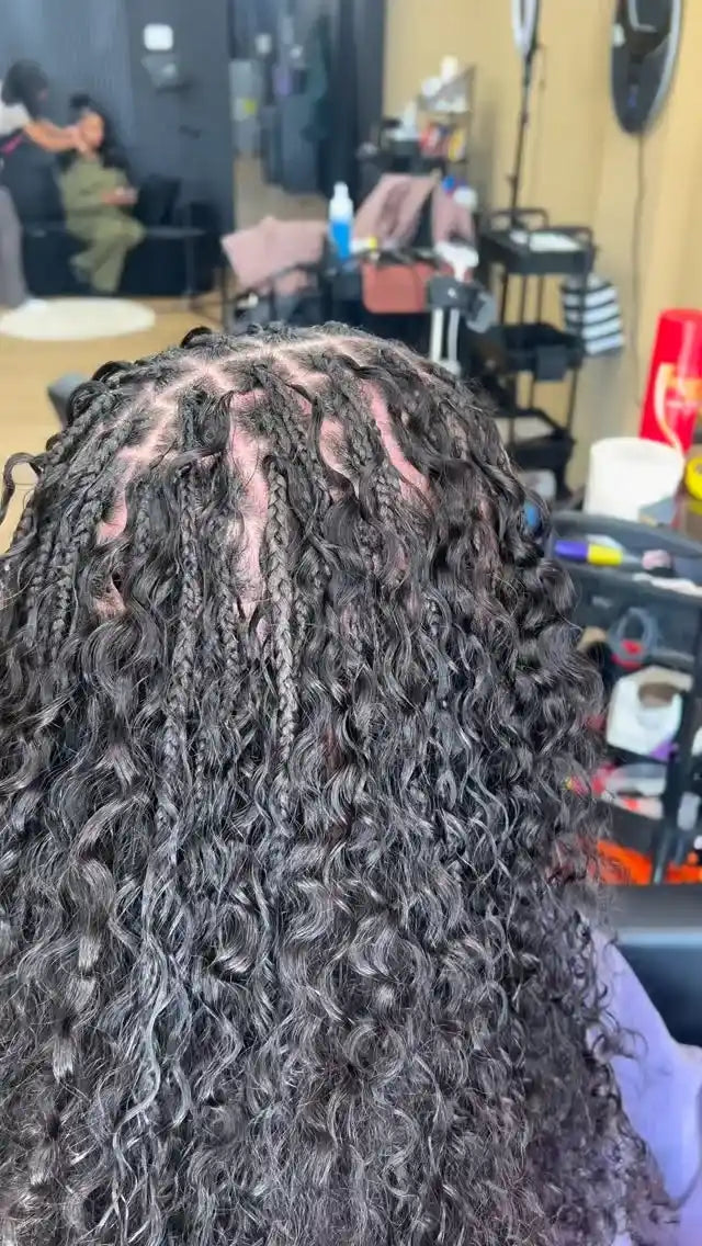 Boho knotless braids with loose deep wave curls, hairstylist located in Reisterstown, MD