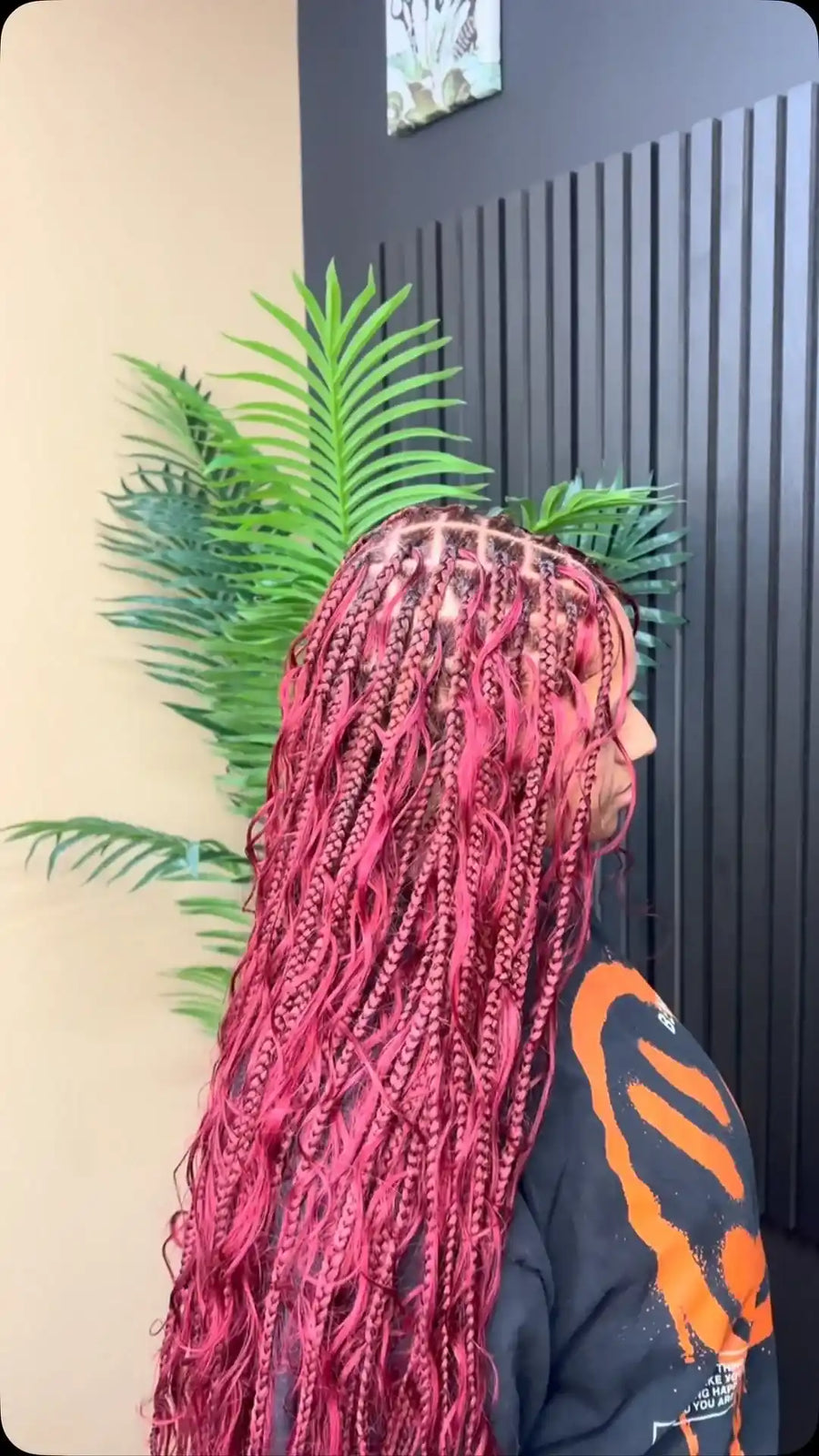 Long pink boho knotless braids with loose wavy curls, hairstylist located in Reisterstown, MD