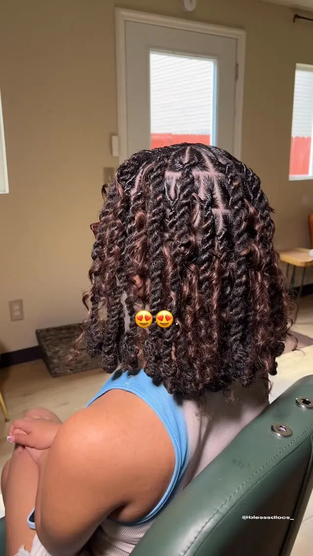 Black textured locs styled in a curly half-up updo with face-framing twists, Stylist located in Bowling Green, KY