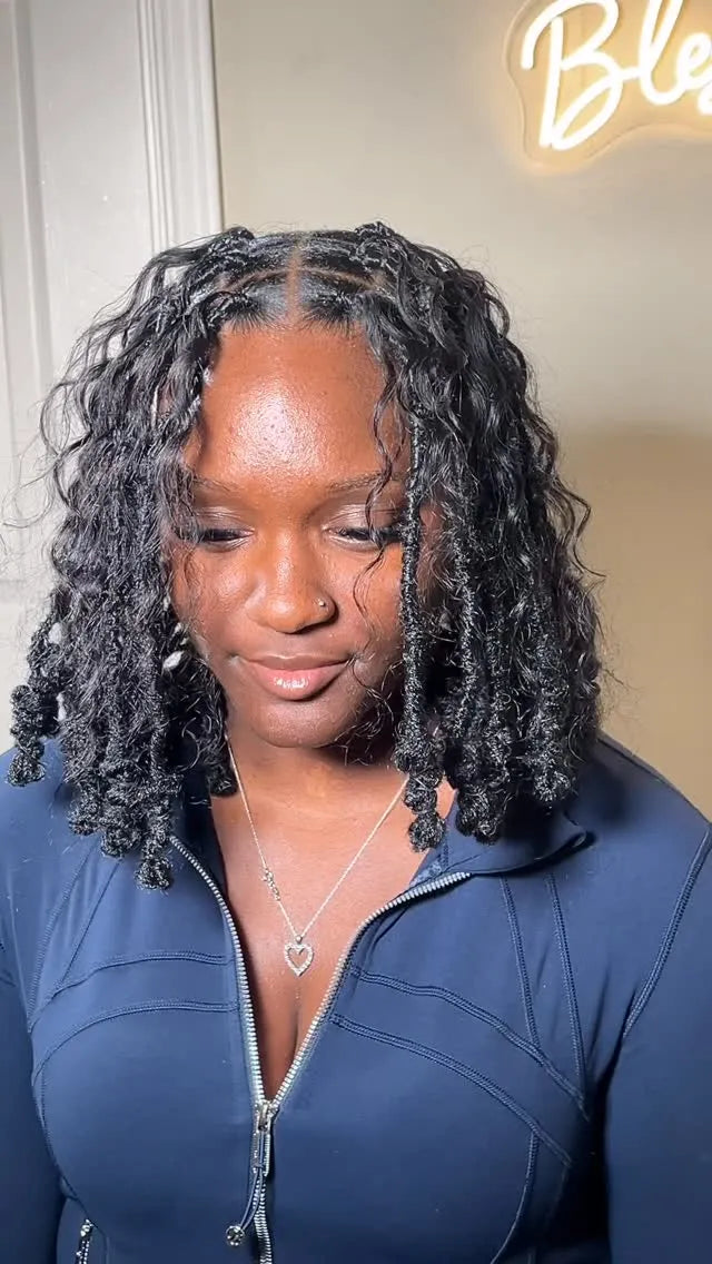 Short black curly locs with braided roots, face-framing twists and voluminous curls, Stylist located in Bowling Green, KY