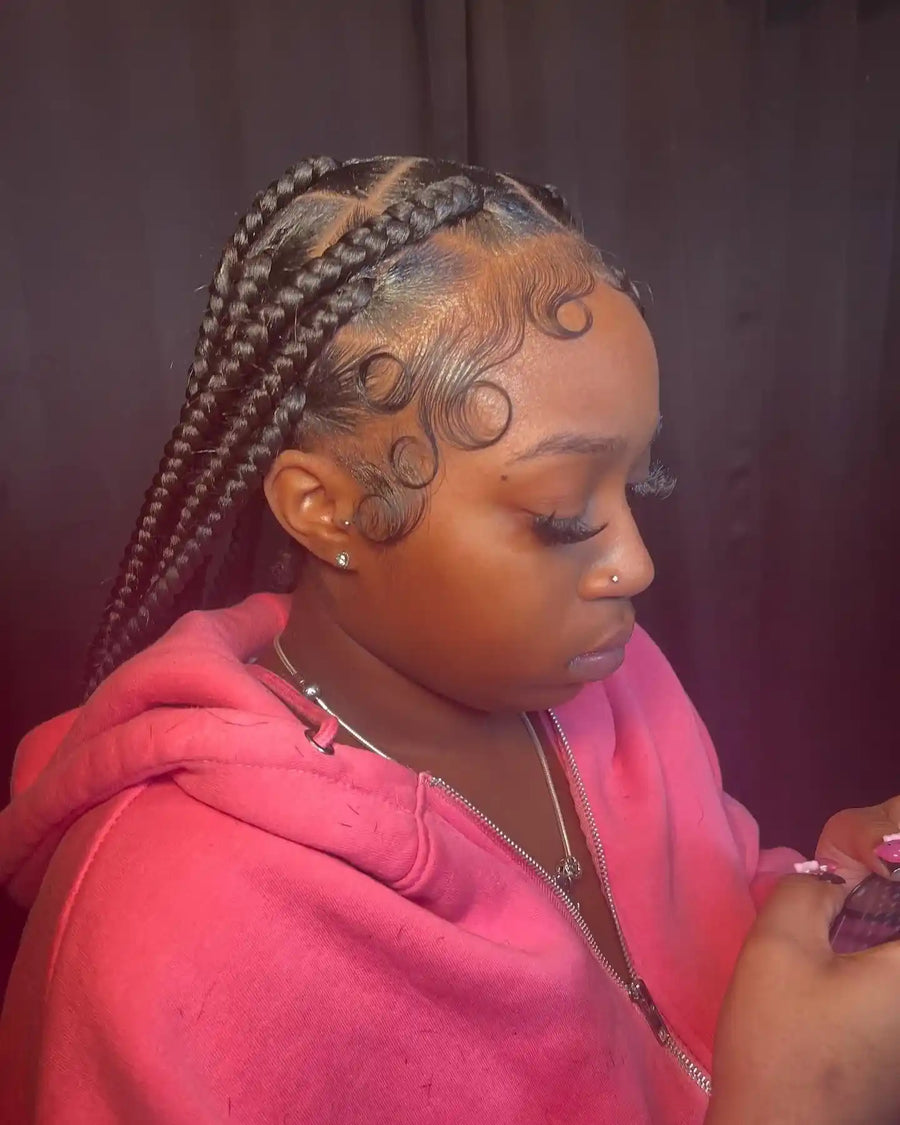 Medium knotless box braids with creative parting and swooped baby hairs, Stylist located in Griffin, GA