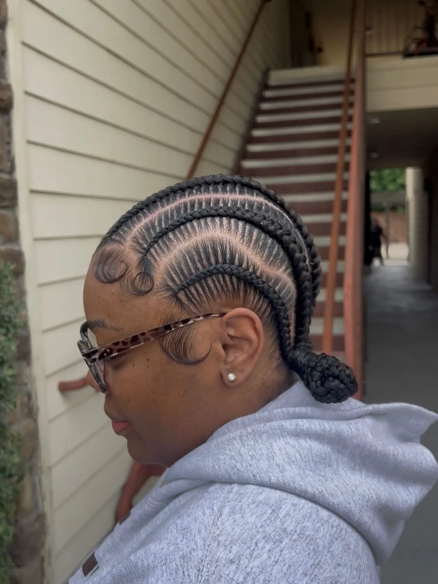 1. Stitch cornrows into a low braided bun with styled edges, Stylist located in Griffin, GA