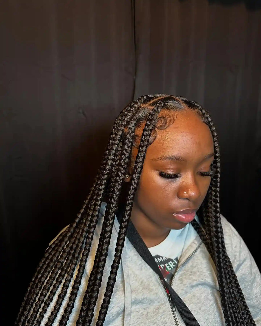 Long knotless box braids with clean scalp parting and sleek edges, Stylist located in Griffin, GA