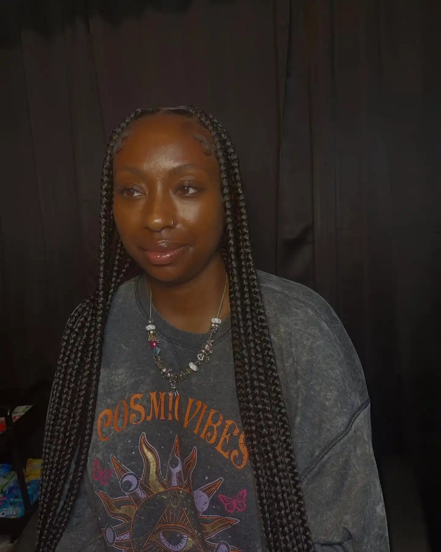 Long medium box braids with center part and neat natural edges, Stylist located in Griffin, GA