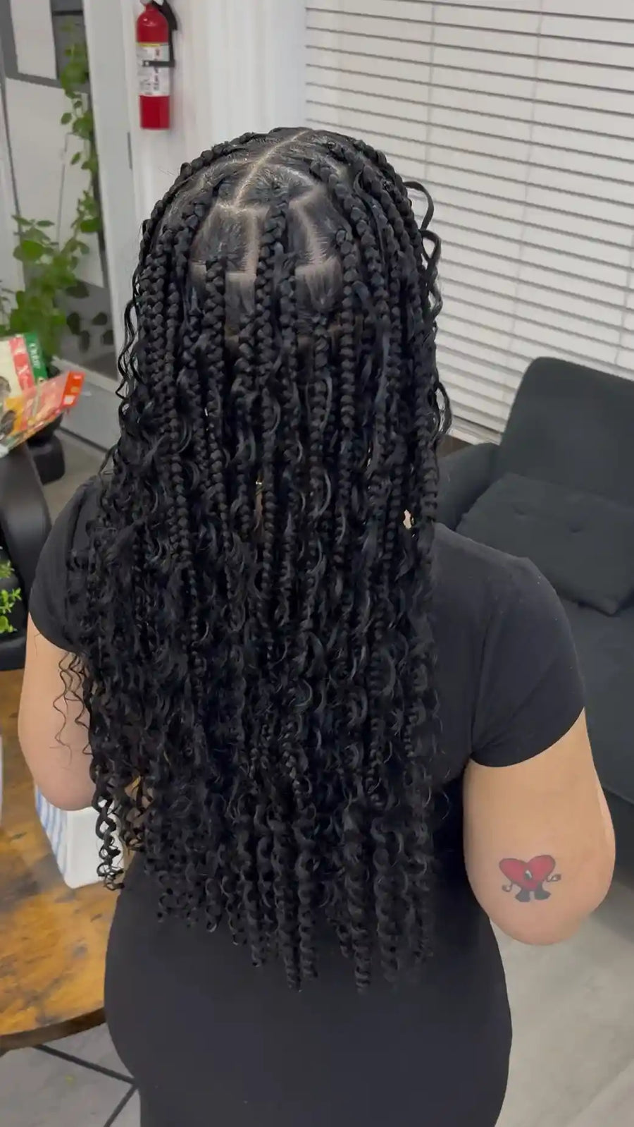 Long black boho knotless braids with loose curls and full curly ends, hairstylist located in Wilkes-Barre, PA
