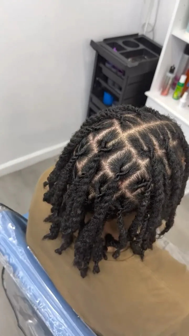 Brown boho braids with curved stitch cornrows and defined curly ends, hairstylist located in Wilkes-Barre, PA