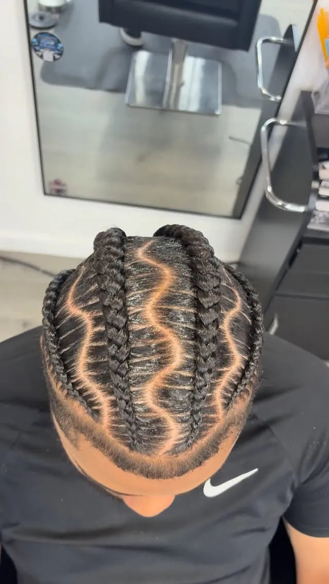 Creative stitch cornrows with a braided star design and sculpted side pattern, hairstylist located in Wilkes-Barre, PA