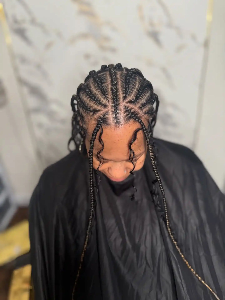 Boho stitch braids with loose curly pieces and clean parting, Stylist located in Philadelphia, PA