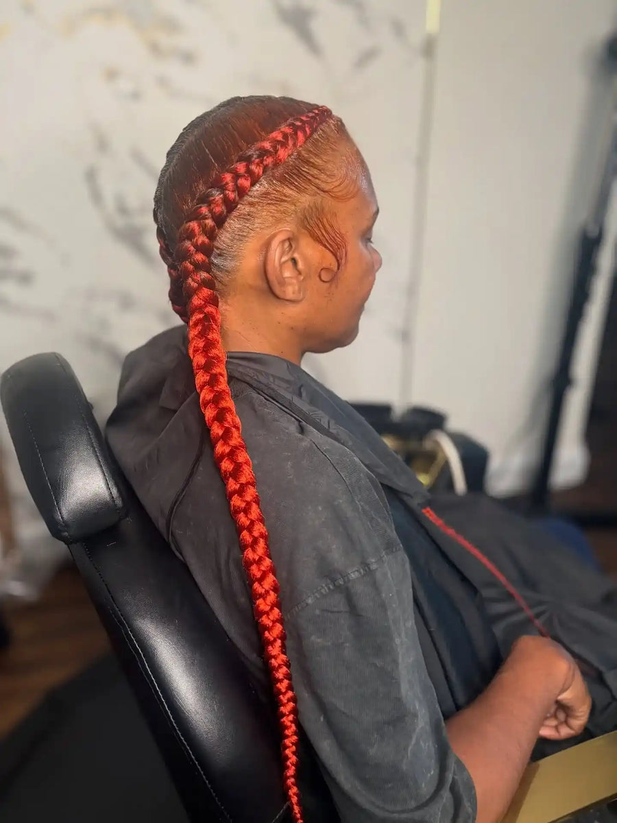 Sleek red braided ponytail with laid edges, Stylist located in Philadelphia, PA
