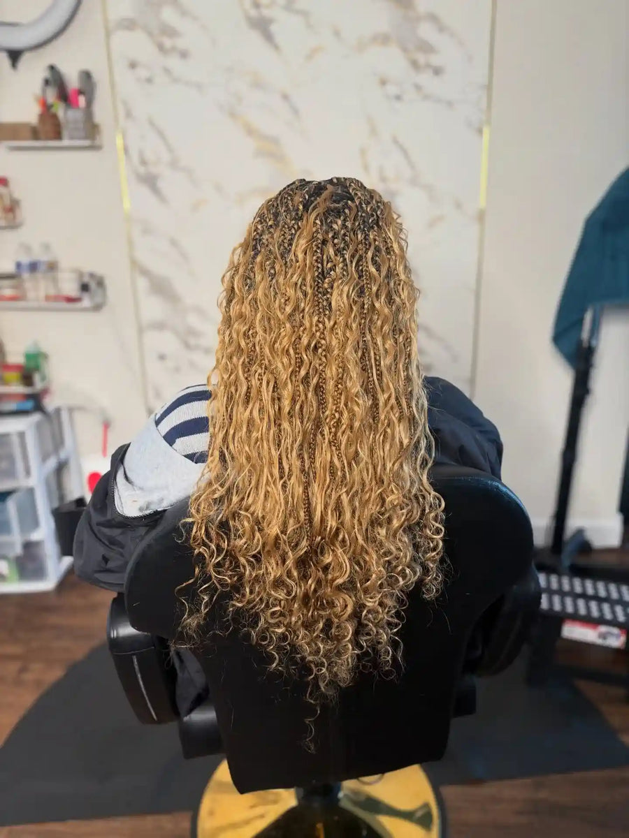 Long blonde boho knotless braids with loose curls, Stylist located in Philadelphia, PA