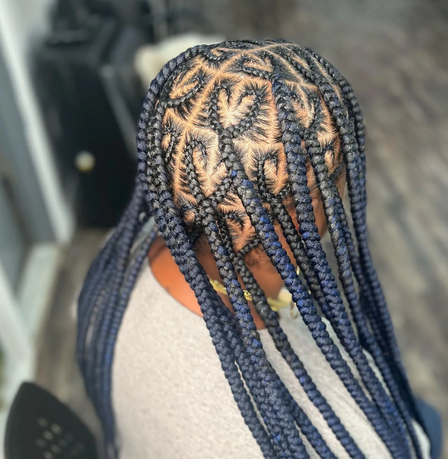 Blue and black feed-in braids with creative scalp parting, hairstylist in Brooklyn, NY