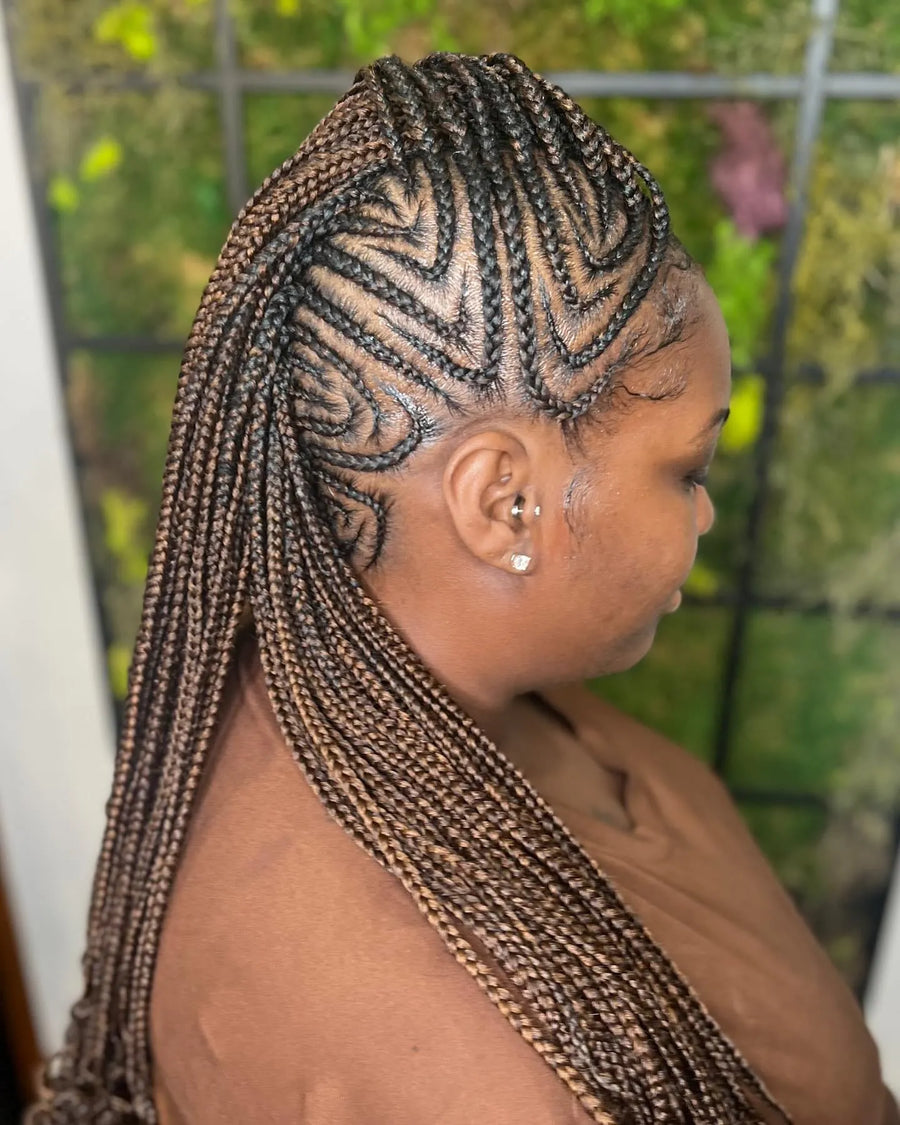 Brown feed-in cornrow braids with intricate side design and long braided length, hairstylist in Brooklyn, NY