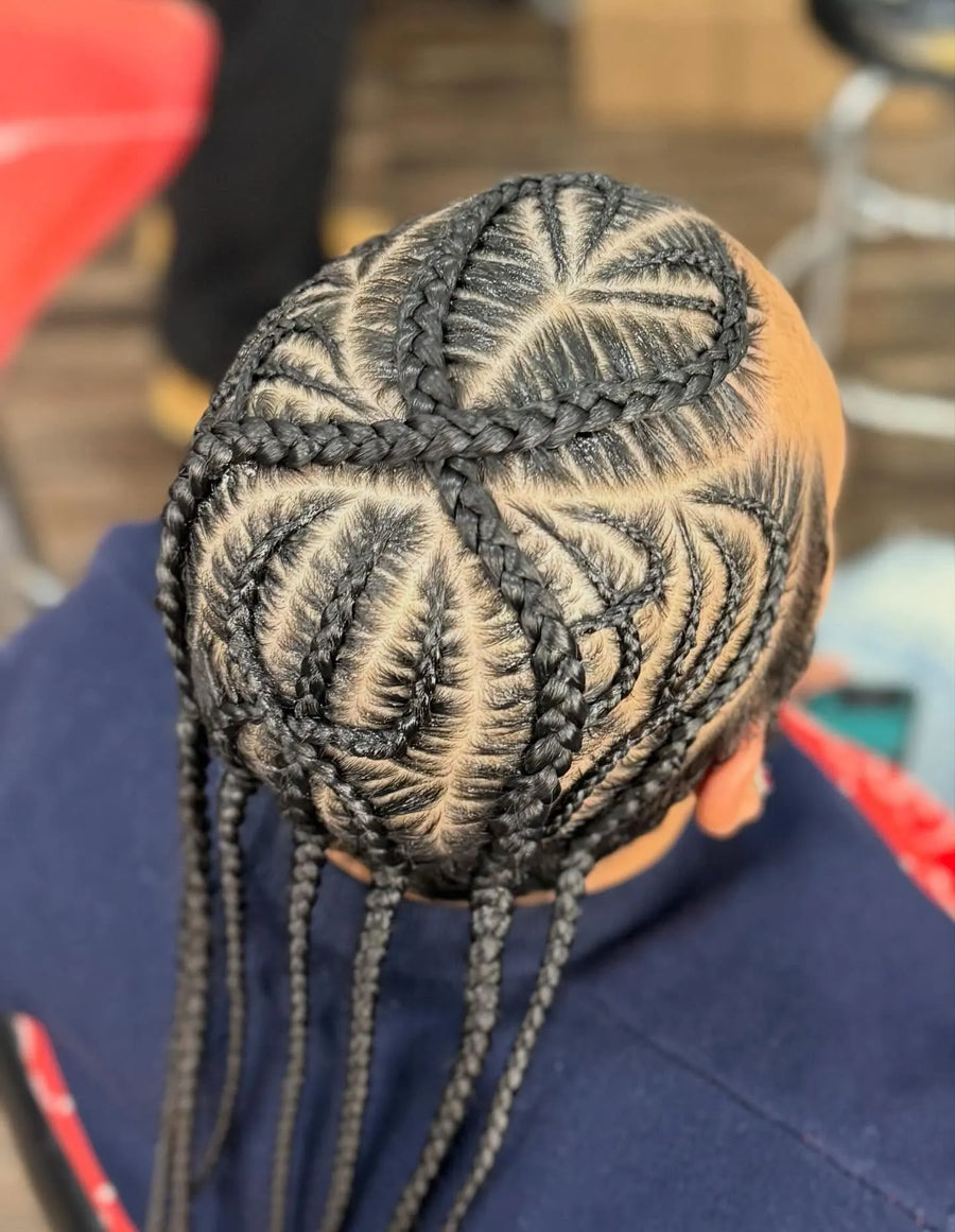 Detailed stitch braid design with heart-shaped parting and hanging braids, hairstylist in Brooklyn, NY
