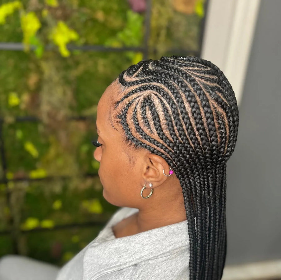 Feed-in cornrow braids with curved side pattern and long straight braids, hairstylist in Brooklyn, NY