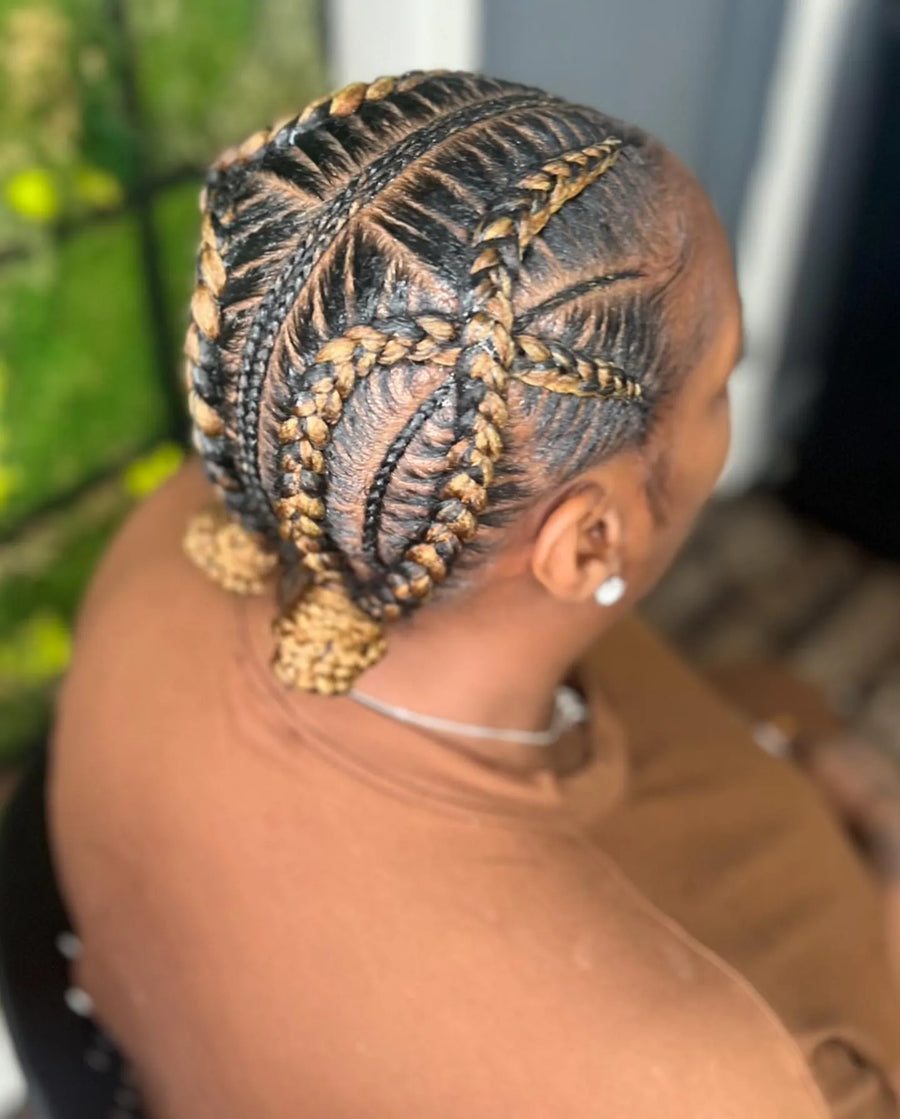 Kids feed-in braids with blonde accents and detailed curved parting, hairstylist in Brooklyn, NY
