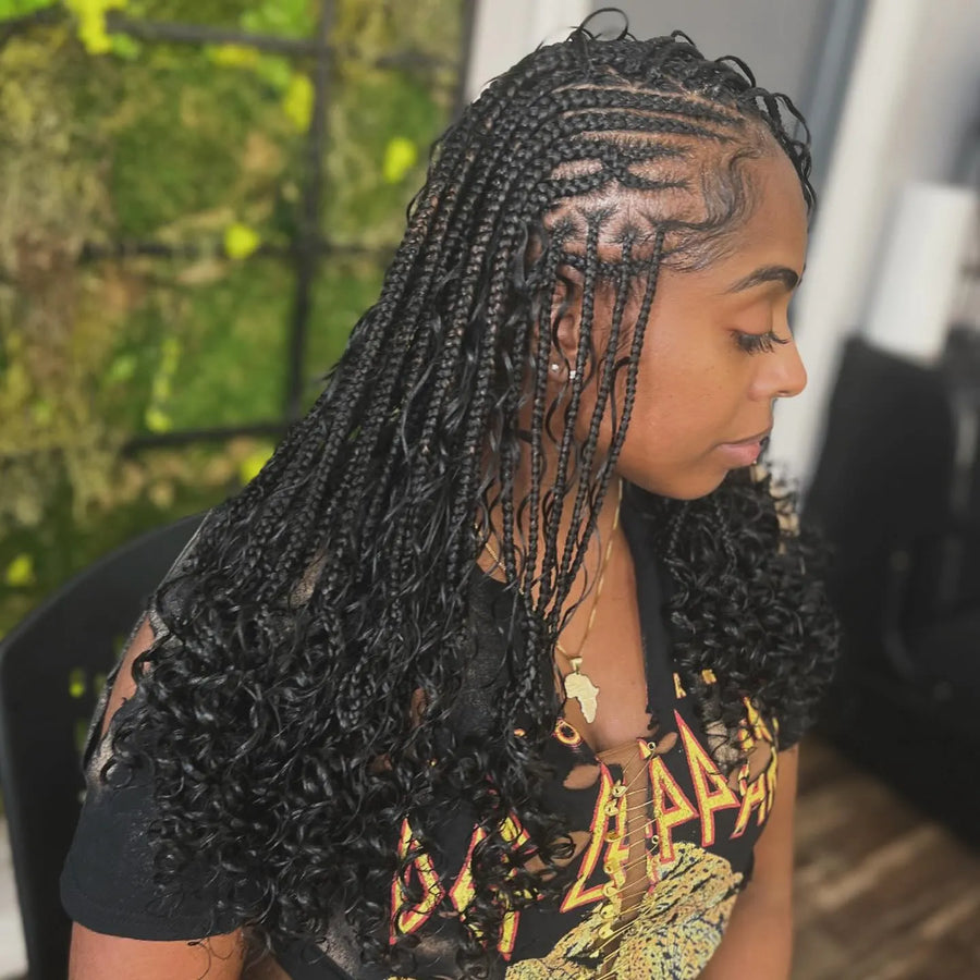 Boho knotless braids with curly ends and clean side parting, hairstylist in Brooklyn, NY