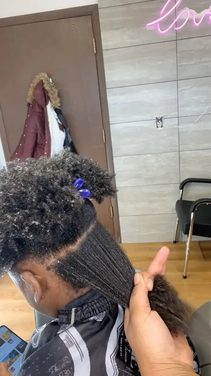 Natural coily hair sectioned and stretched during preparation for a protective style, hairstylist located in Bettendorf, IA