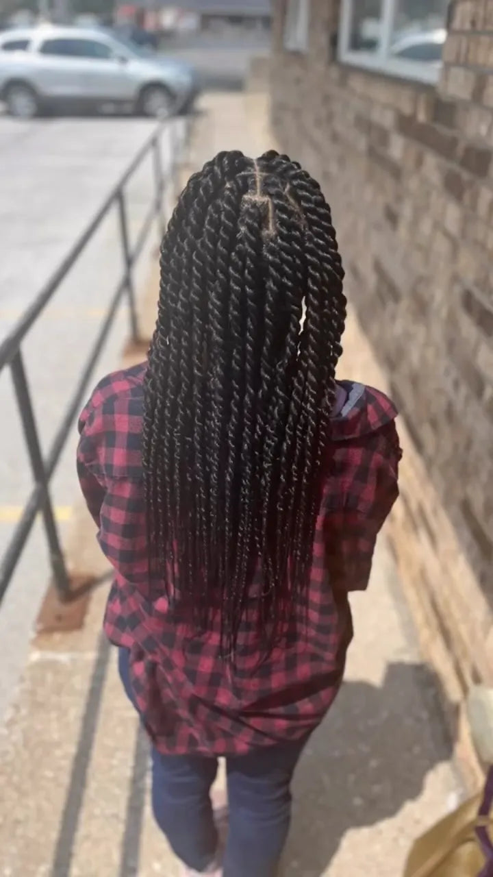 Waist-length black Senegalese twists with clean square parts, hairstylist located in Bettendorf, IA
