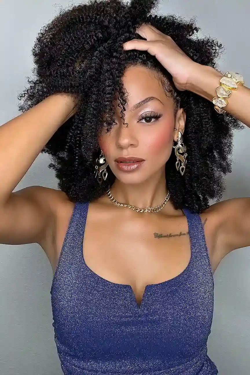 Model wearing Afro kinky curly feather crochet human hair extensions