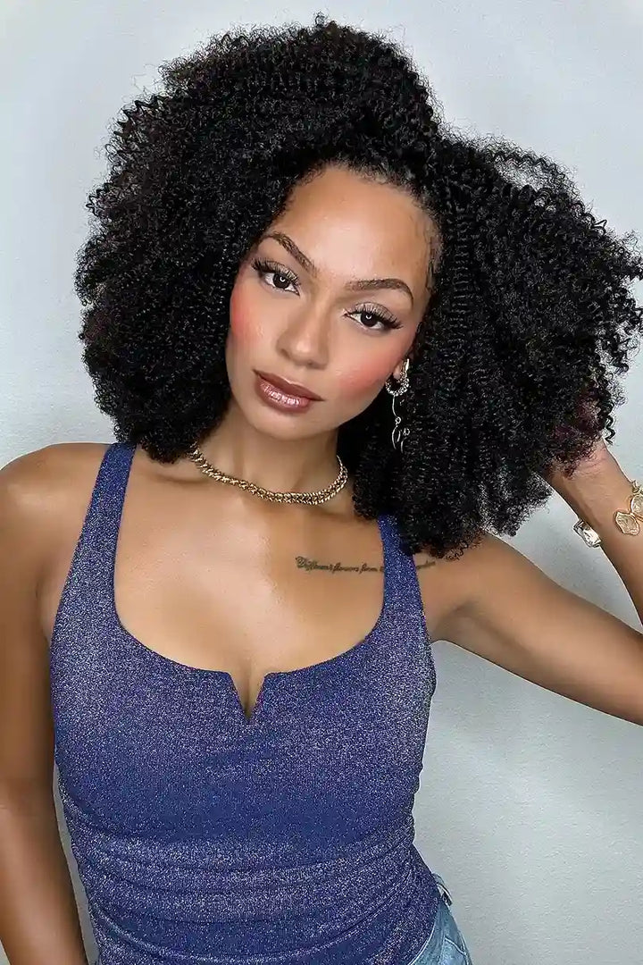 Model wearing Afro kinky curly feather crochet human hair extensions