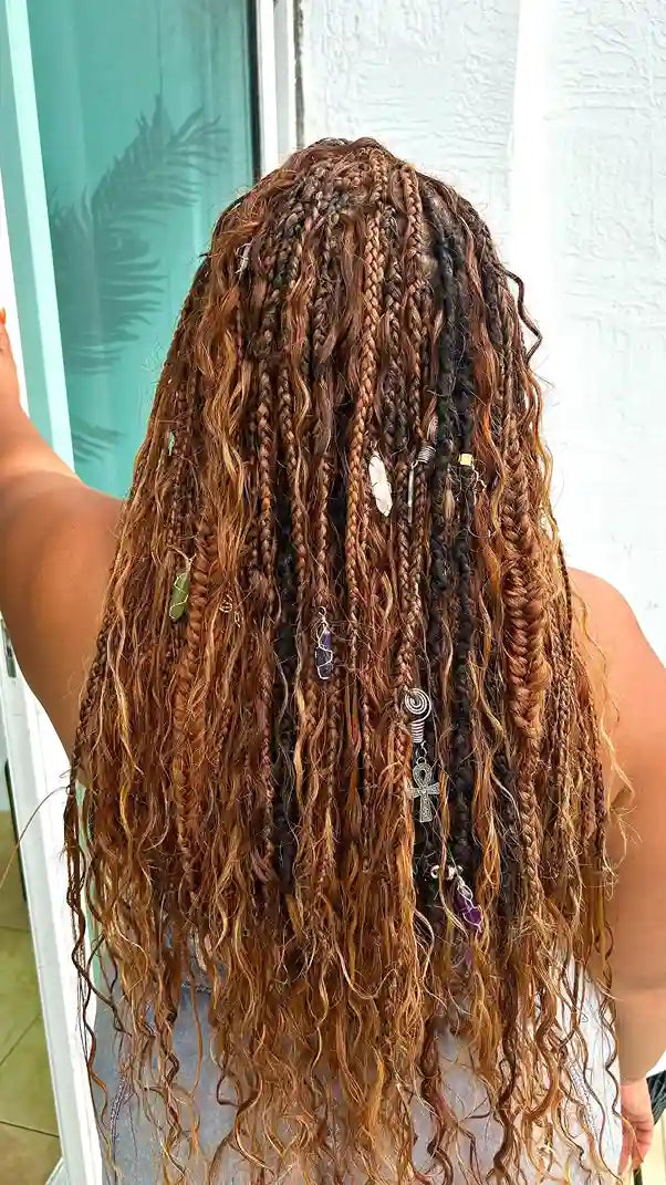 Long straight black boho braids with sleek loose hair and a side part, hairstylist located in Jacksonville, FL