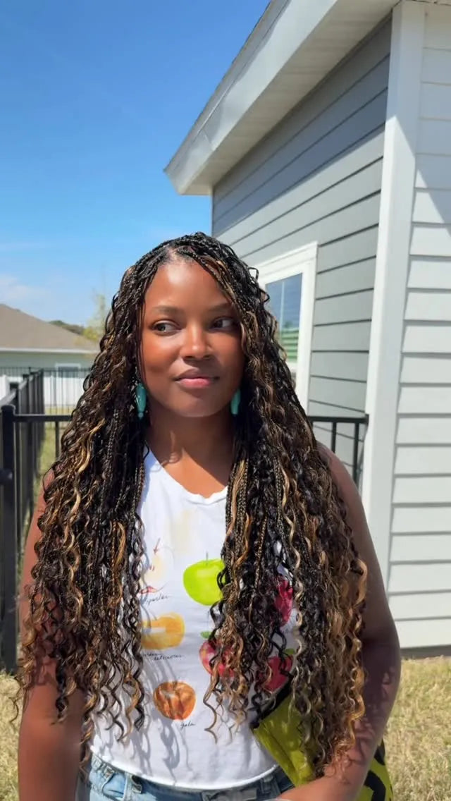 Extra-long black soft locs with brown curly ombre ends, hairstylist located in Jacksonville, FL