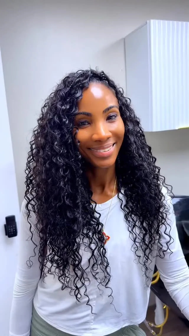 Extra-long black goddess braids with honey-blonde curly highlights, hairstylist located in Jacksonville, FL