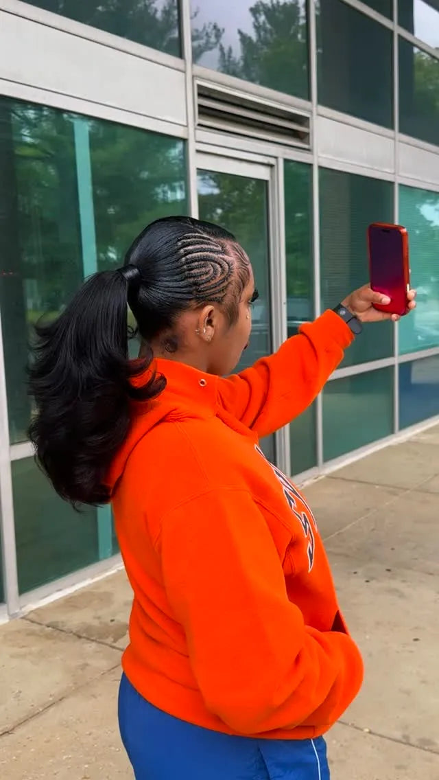 Curved stitch cornrows styled into a sleek high ponytail with voluminous curled ends, hairstylist located in Lanham, MD
