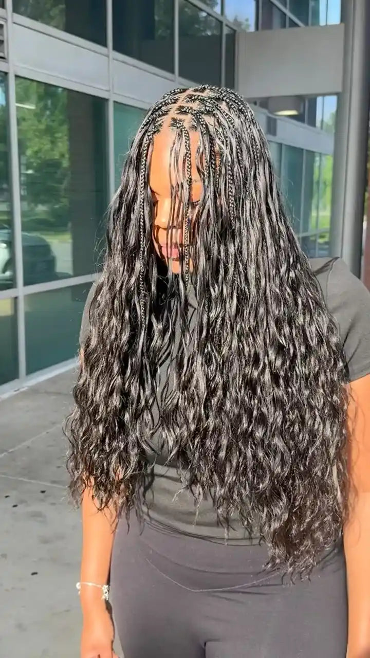Long boho braids with loose wet-wave curls and small individual braids throughout, hairstylist located in Lanham, MD