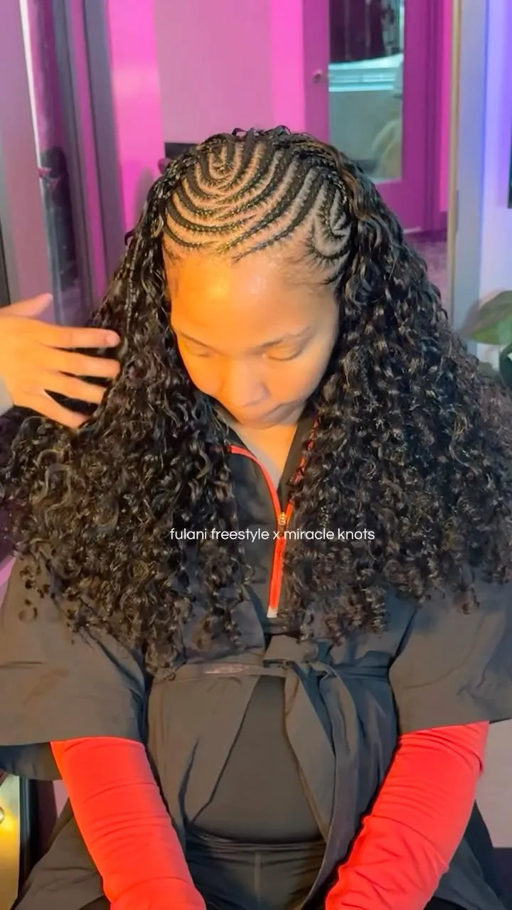 Fulani freestyle braids with curved cornrows and full curly miracle knot extensions, hairstylist located in Lanham, MD