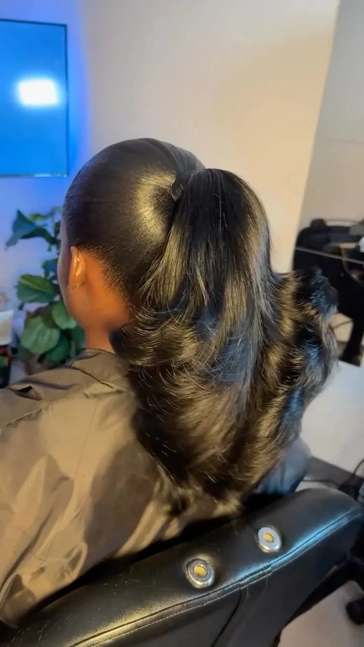 Sleek high ponytail with smooth roots and large flipped curls at the ends, hairstylist located in Lanham, MD