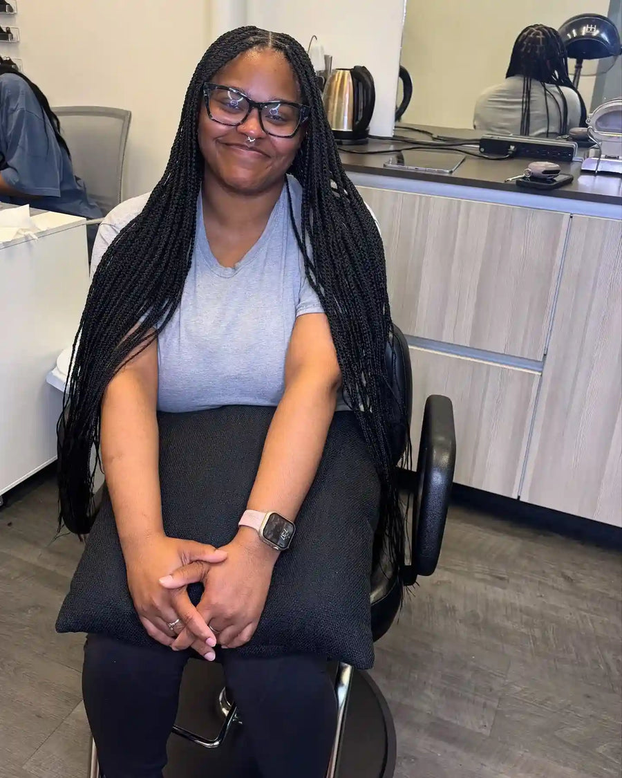 Long black box braids with clean middle part, hairstylist in Buffalo, NY