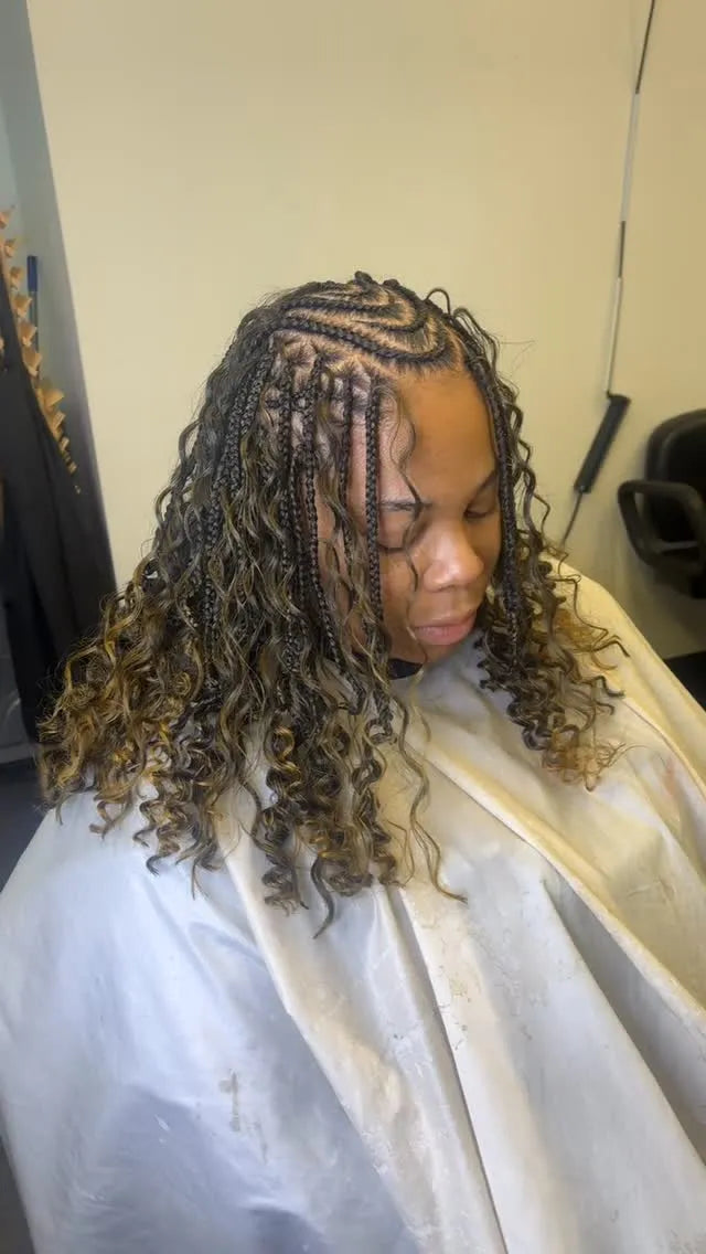 Medium boho braids with brown highlights and loose curly ends, hairstylist in Buffalo, NY
