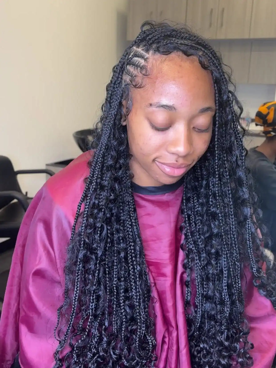 Stitch braids into curly puff style with clean side parting, hairstylist in Buffalo, NY